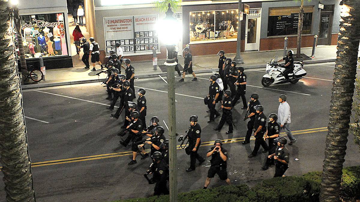 Police State Armed police advance on civilians